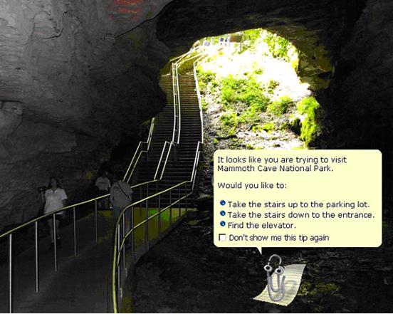 Image of a tourist cave showing photo of cave with Microsoft
						Office-style help window reading "It looks like you are trying to visit
						Mammoth Cave National Park. Would you like to: Take the stairs up to the
						parking lot; Take the stairs down to the entrance; Find the elevator; Don't
						show me this tip again."